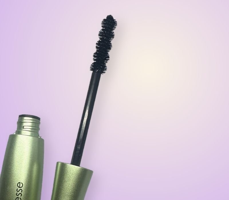 Mirenesse Organic 24hr Mascara Tubing spiral wand, close-up on cream and lilac background